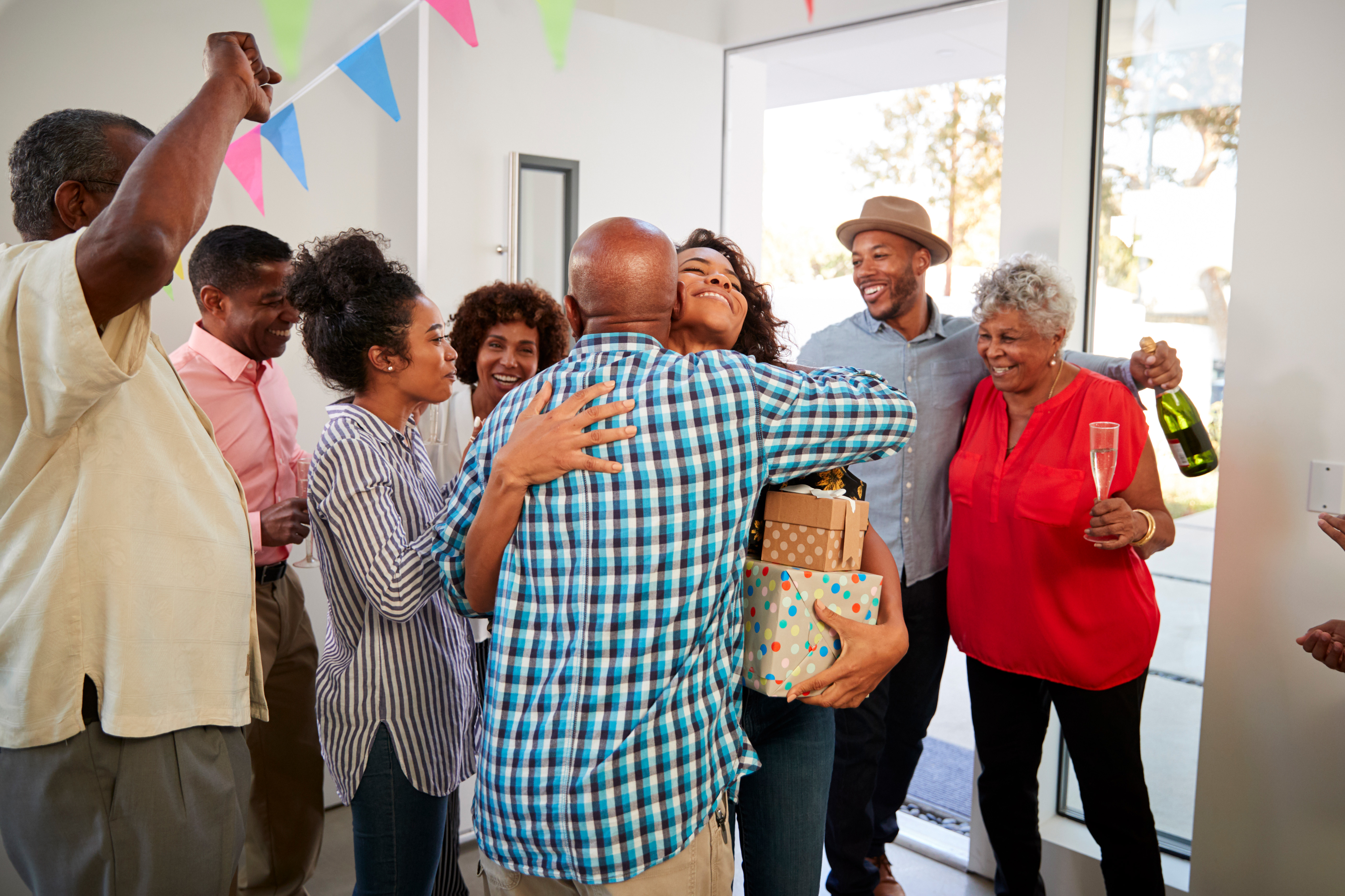 black-grandparents-welcoming-guests-to-their-NQ3LAS6