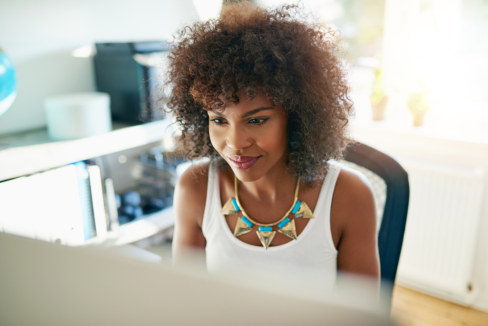 attractive-young-woman-working-on-a-computer-PB2AHPT