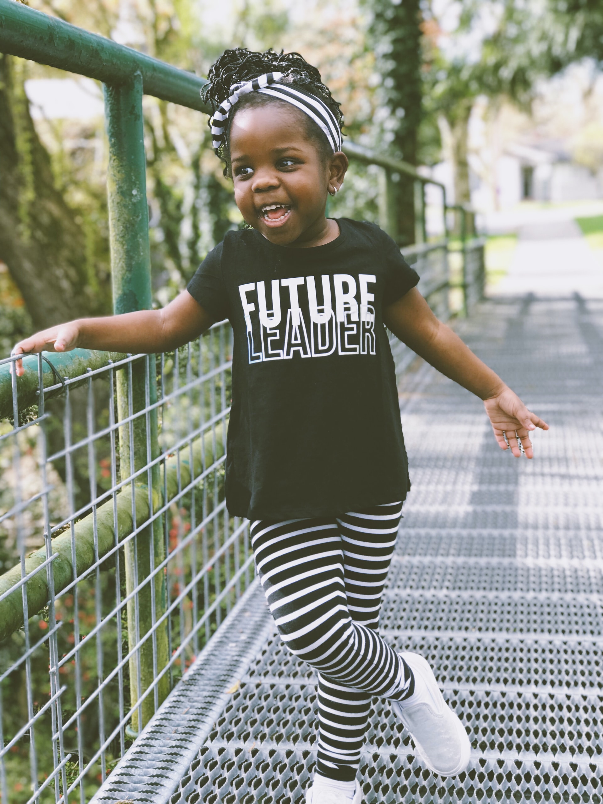 Young Black girl with a shirt that says Future Leader
