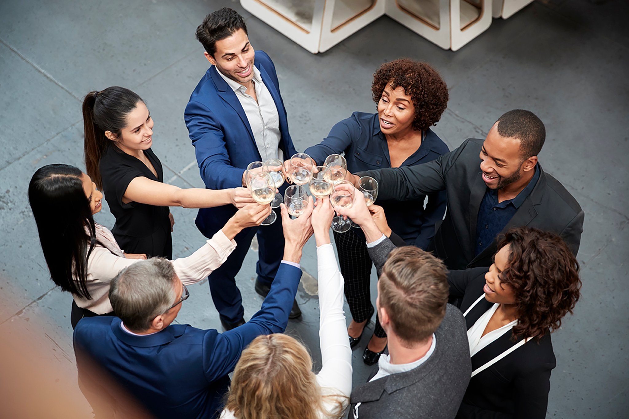 overhead-shot-of-business-team-celebrating-5KFSWBH